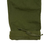 General detail shot of Topo Designs Men's Dirt Pants in Olive green showing drawstring at bottom cuff.