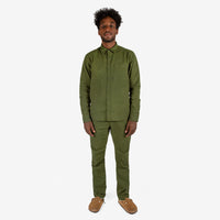 Full front model shot of Topo Designs Men's Dirt Shirt & Pants in "Olive" green.