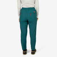 Close-up back model shot of Topo Designs Women's Lightweight Tech Pants in "Juniper" green.