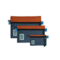 Topo Designs Accessory Bags - product shot of the "Medium", "Small", and "Micro" accessory bags in "Clay / Pond Blue - Recycled" nylon.