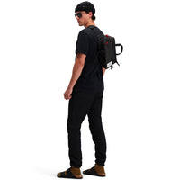 Back model shot of Topo Designs Men's Dirt Pants 100% organic cotton drawstring waist in "black"