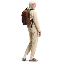 Back model shot of Topo Designs Women's Dirt Pants in 100% organic cotton with drawstring waist in "Sand" white
