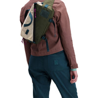 Back model shot of Topo Designs Women's Dirt Pants in 100% organic cotton with drawstring waist in "Pond Blue"