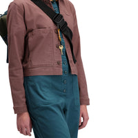 Front model shot of Topo Designs Women's Dirt Coverall 100% organic cotton short sleeve jumpsuit in "pond blue"