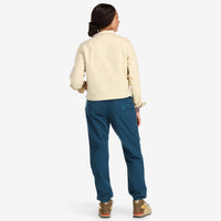 Back model shot of Topo Designs Women's Dirt Pants in 100% organic cotton with drawstring waist in "pond blue". Show on "Olive"