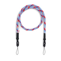 Topo Designs Camera Strap in "Bone White / Blue" and red.