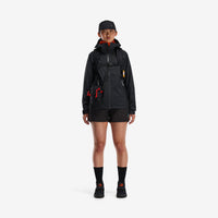 General shot of Topo Designs Women's Global Jacket lightweight packable 10k waterproof rain coat in recycled black polyester on model.