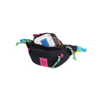 Open main compartment view of Topo Designs Mountain Waist Pack in lightweight recycled "Black / Pink" nylon.
