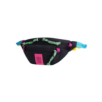 Side view of Topo Designs Mountain Waist Pack in lightweight recycled "Black / Pink" nylon.