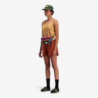 General on model shot, waist view of Topo Designs Mountain Waist Pack in lightweight recycled "Burgundy / Dark Khaki" nylon.