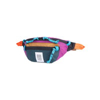 Side view of Topo Designs Mountain Waist Pack in lightweight recycled "Botanic Green / Grape" nylon.