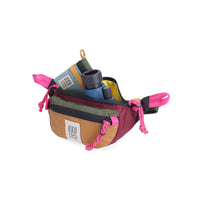 Open main compartment view of Topo Designs Mountain Waist Pack in lightweight recycled "Burgundy / Dark Khaki" nylon.
