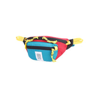 Side view of Topo Designs Mountain Waist Pack in lightweight recycled "Red / Turquoise" nylon.